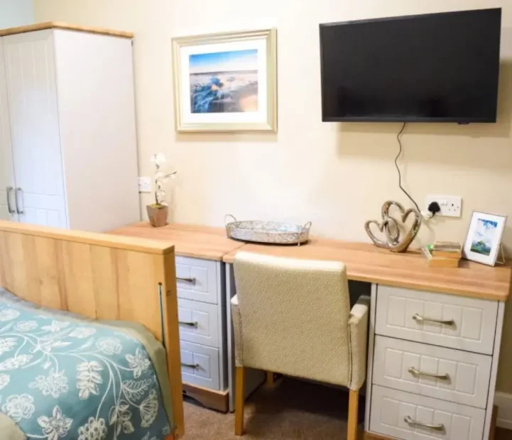 Comfortable resident bedroom at Albany nursing home in Headington