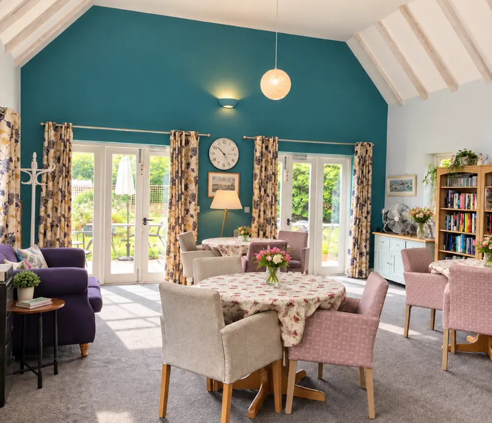 Bright communal lounge at Aldringham Court care home