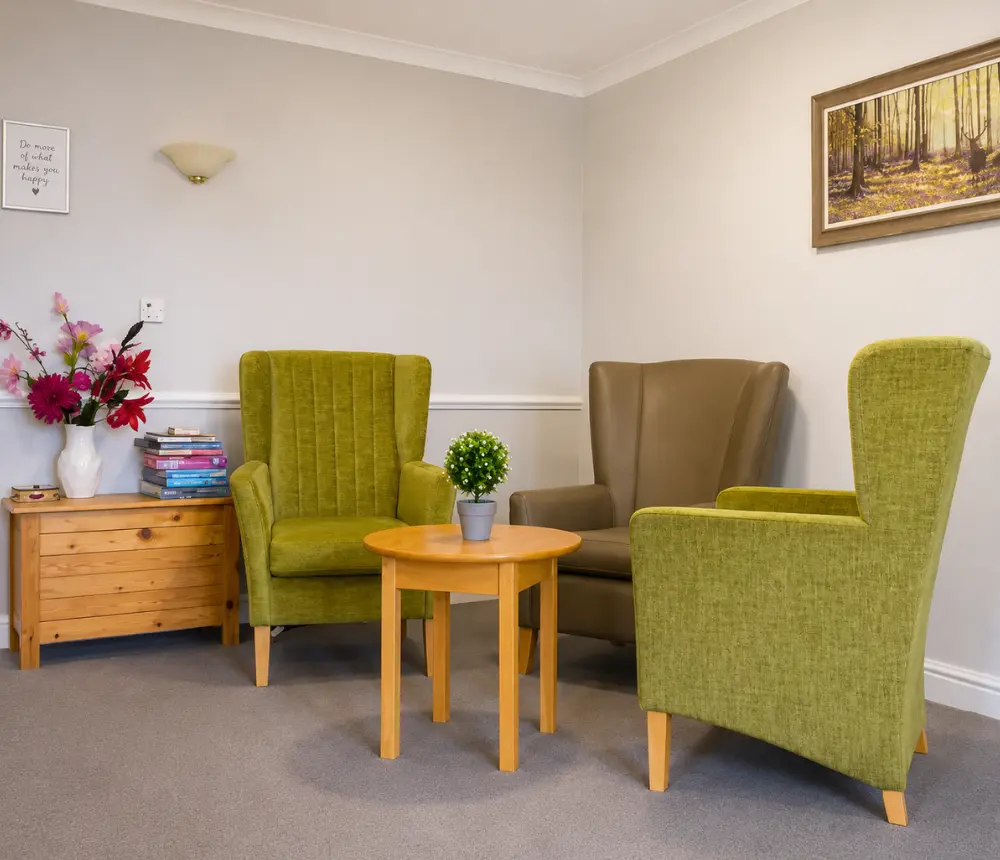 Comfortable lounge area at Avon Lodge nursing and dementia care home in Kingswood, Bristol, with armchairs and homely furnishings.