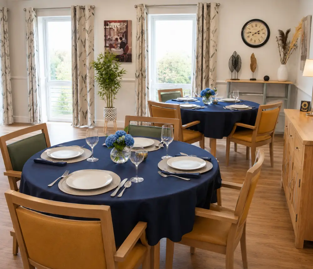 Bright dining room at Avon Lodge nursing and dementia care home in Kingswood, Bristol, with comfortable seating and beautifully presented dining tables.