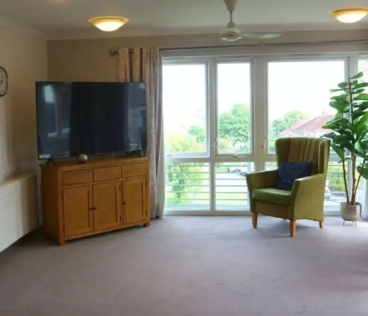 Bright communal lounge at Avon Lodge nursing home in Bristol
