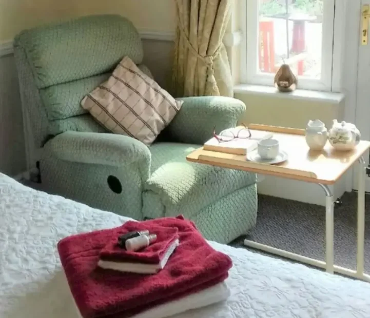 Comfortable resident bedroom at Barking Hall nursing home in Suffolk