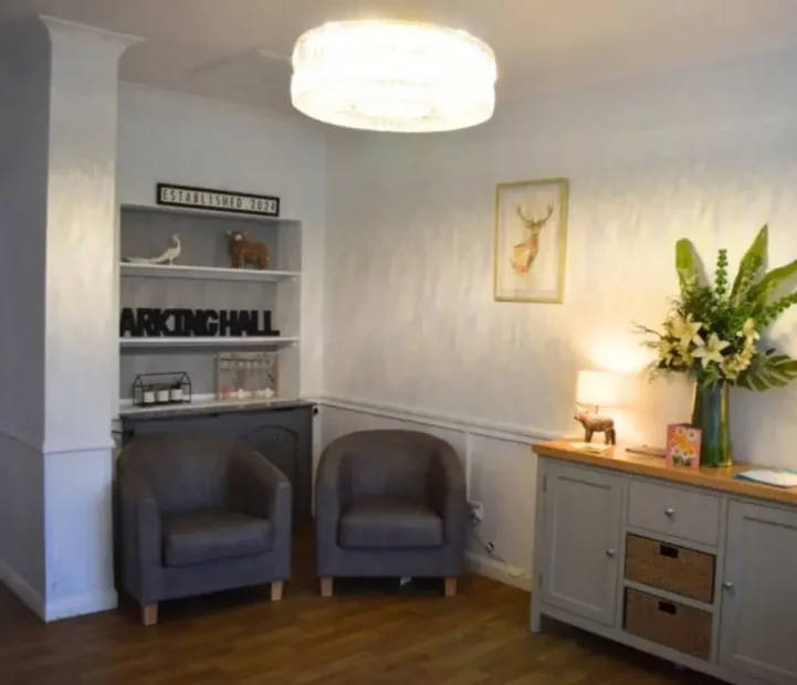 Welcoming communal lounge at Barking Hall nursing home in Suffolk
