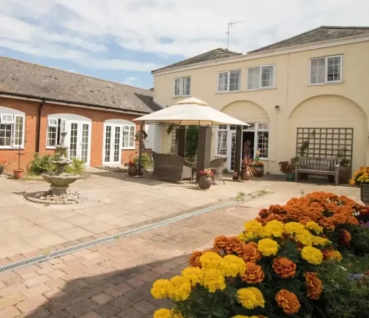 Courtyard garden with outdoor seating at Barking Hall nursing home