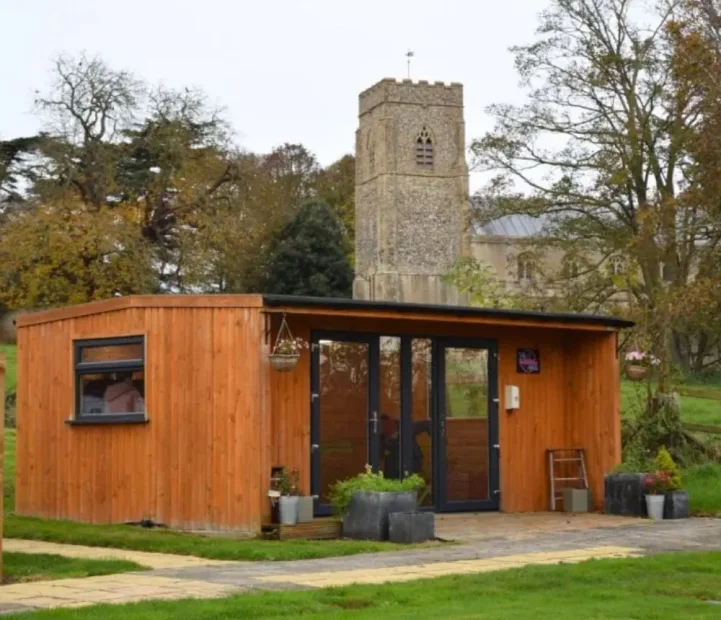 Garden lodge at Barking Hall nursing home with views of the village church