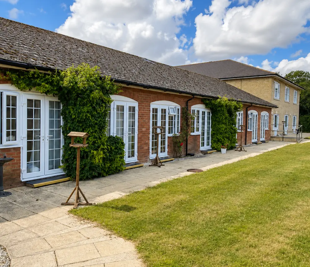 Garden and exterior of Barking Hall Nursing Home in Barking, Suffolk