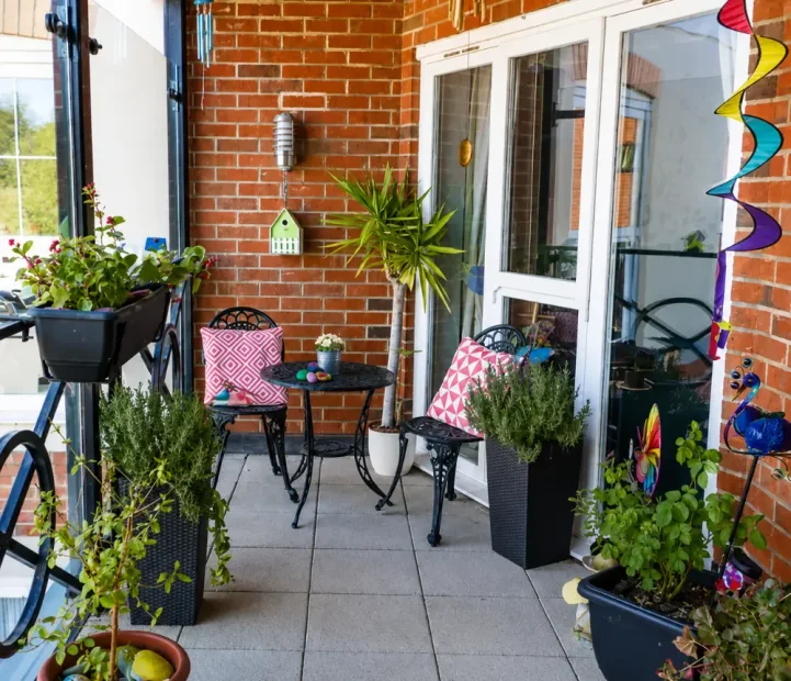 Plant-filled balcony at Blandford Grange Care Home in Blandford Forum, Dorset