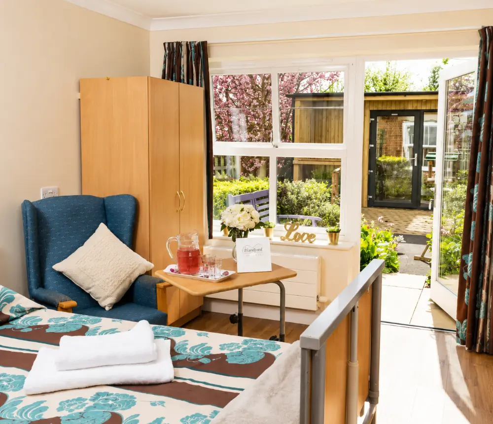 Bright bedroom with garden access at Blandford Grange Care Home in Blandford Forum, Dorset