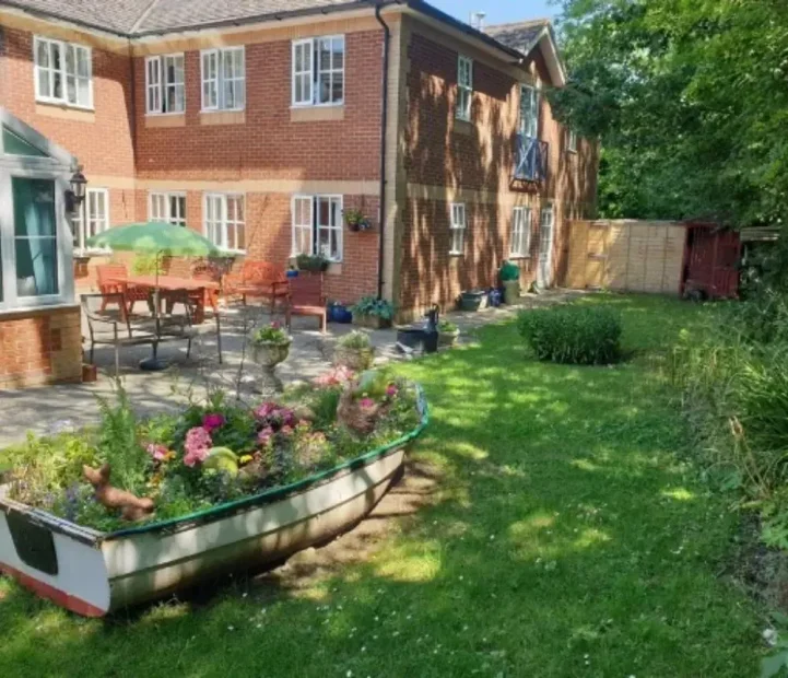 Landscaped garden and patio at Ladymead Nursing Home in Swindon