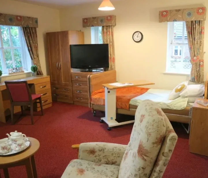 Spacious resident bedroom at Ladymead Nursing Home in Swindon
