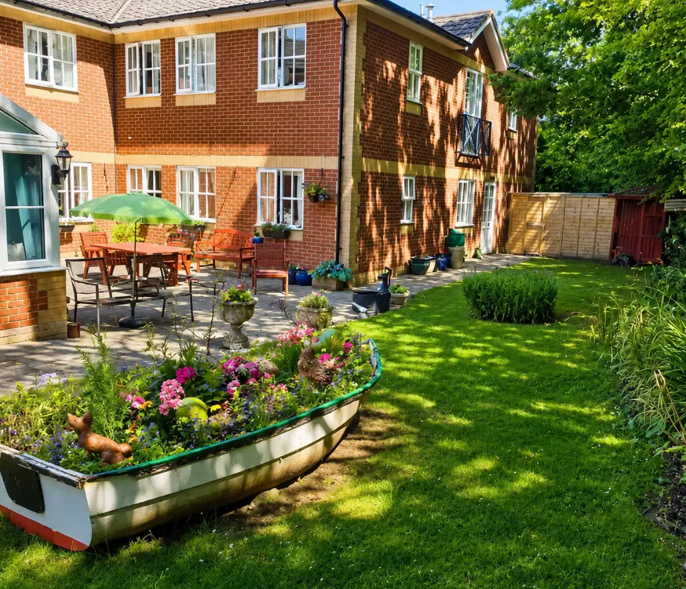 Landscaped garden at Ladymead nursing and residential care home in Swindon, with colourful flowers and outdoor seating.