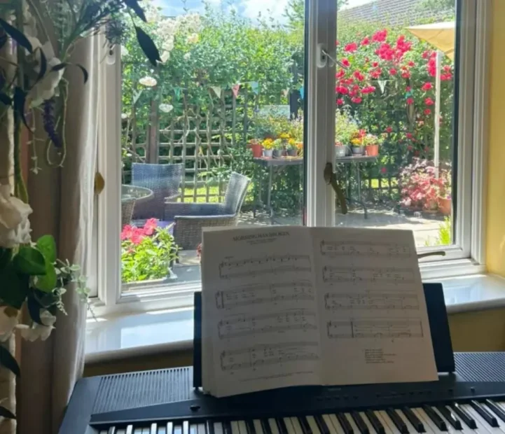Music room overlooking the garden at Olive House care home in Newton Flotman