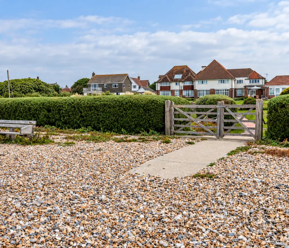 Landscaped gardens overlooking the sea at Tenchley Manor care home in Chichester.