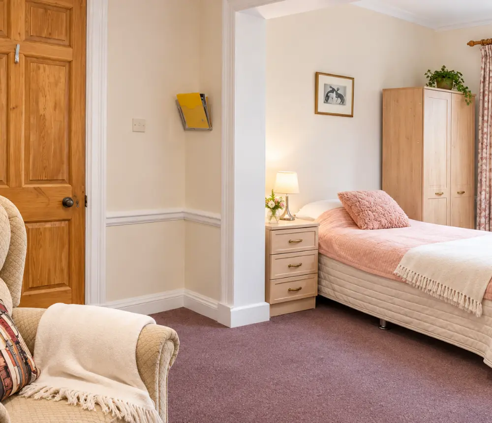 Comfortable bedroom at The Manor House care home in North Walsham