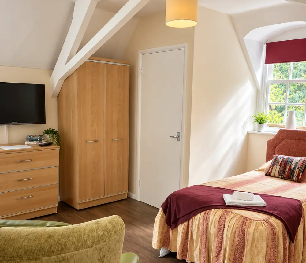 Bright single bedroom at The Manor House care home