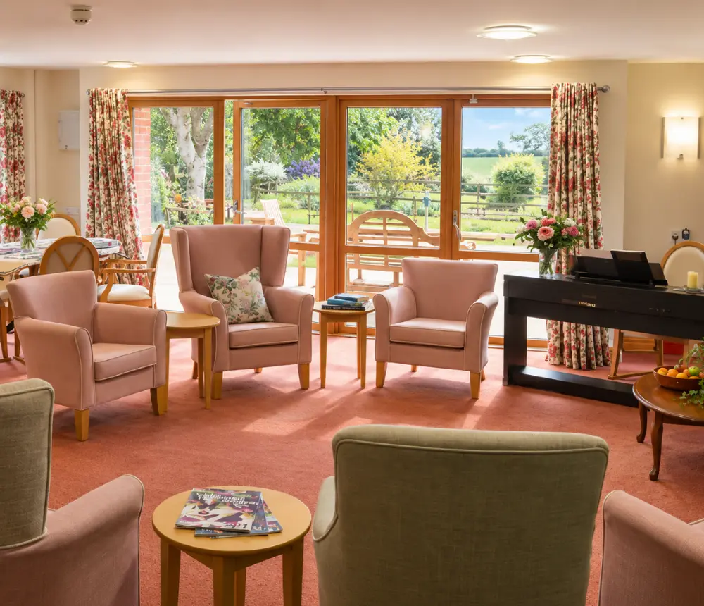 Communal lounge at The Old Vicarage care home in Sherborne, Dorset
