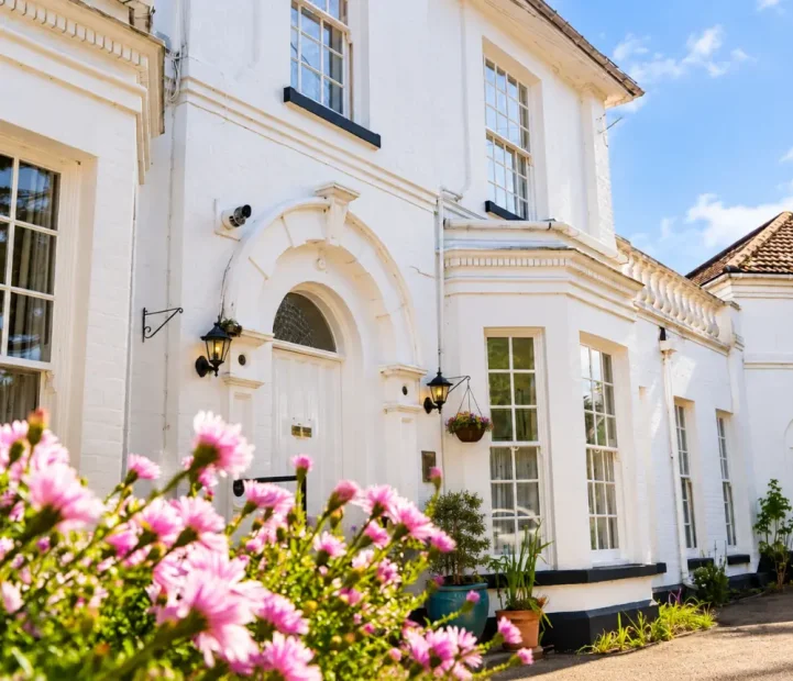 White period building and main entrance at The White House care home in Beccles.