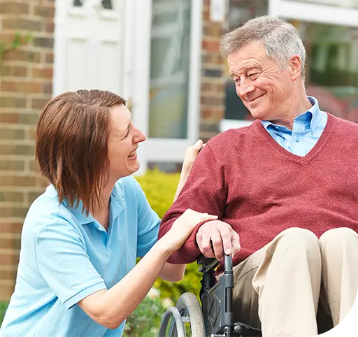 Man in wheelchair with carer