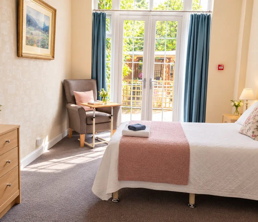 Bright bedroom with garden access at The White House residential care home in Beccles.