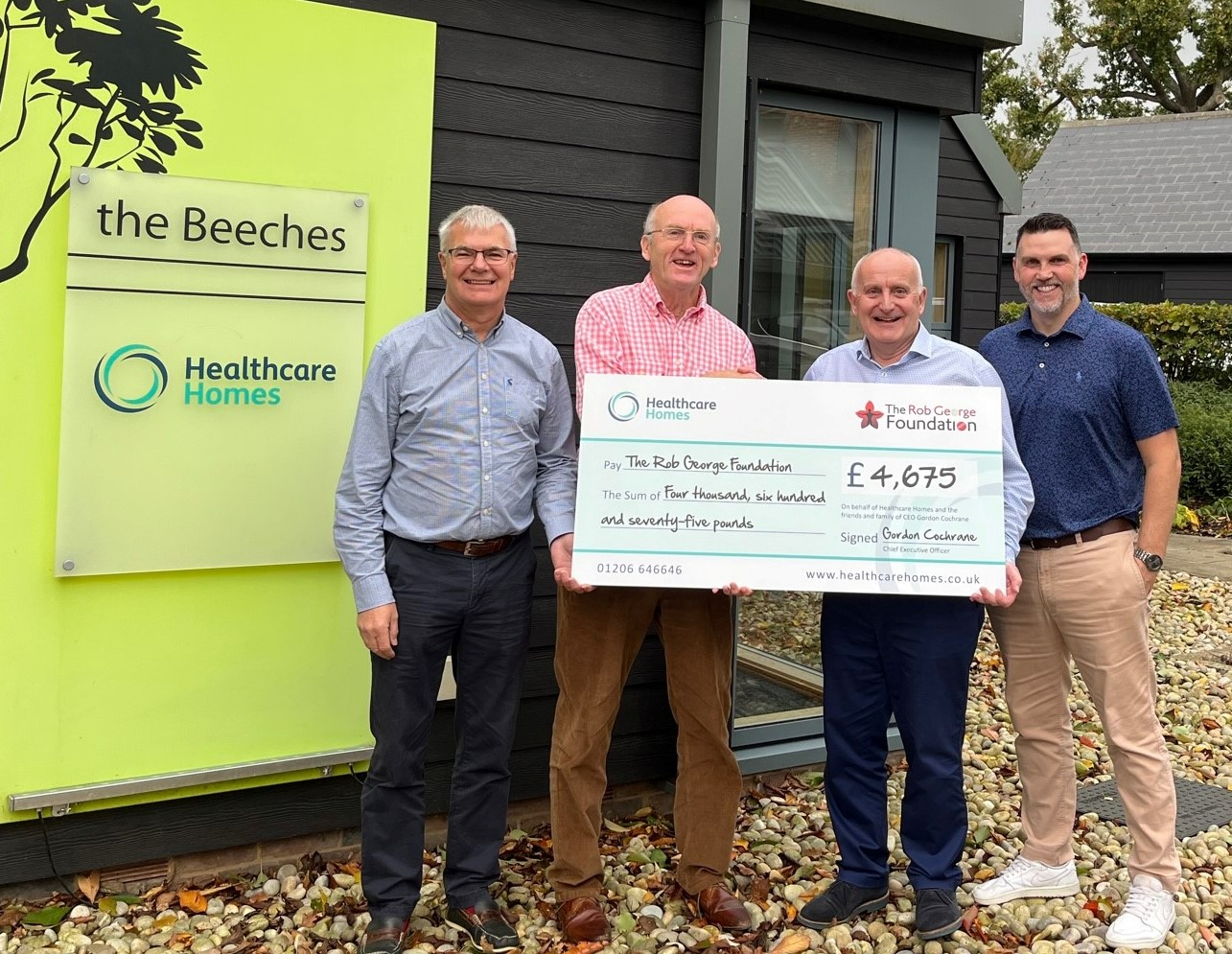 Healthcare Homes presents £4675 to The Rob Foundation
