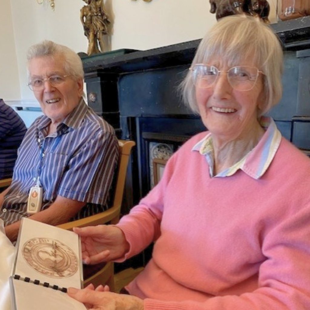 Residents at Uvedale Hall taking part in the Royal Mint reminiscence box activity.