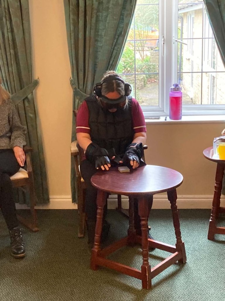 Healthcare Homes colleague participating in GERT suit training at The Malthouse care home