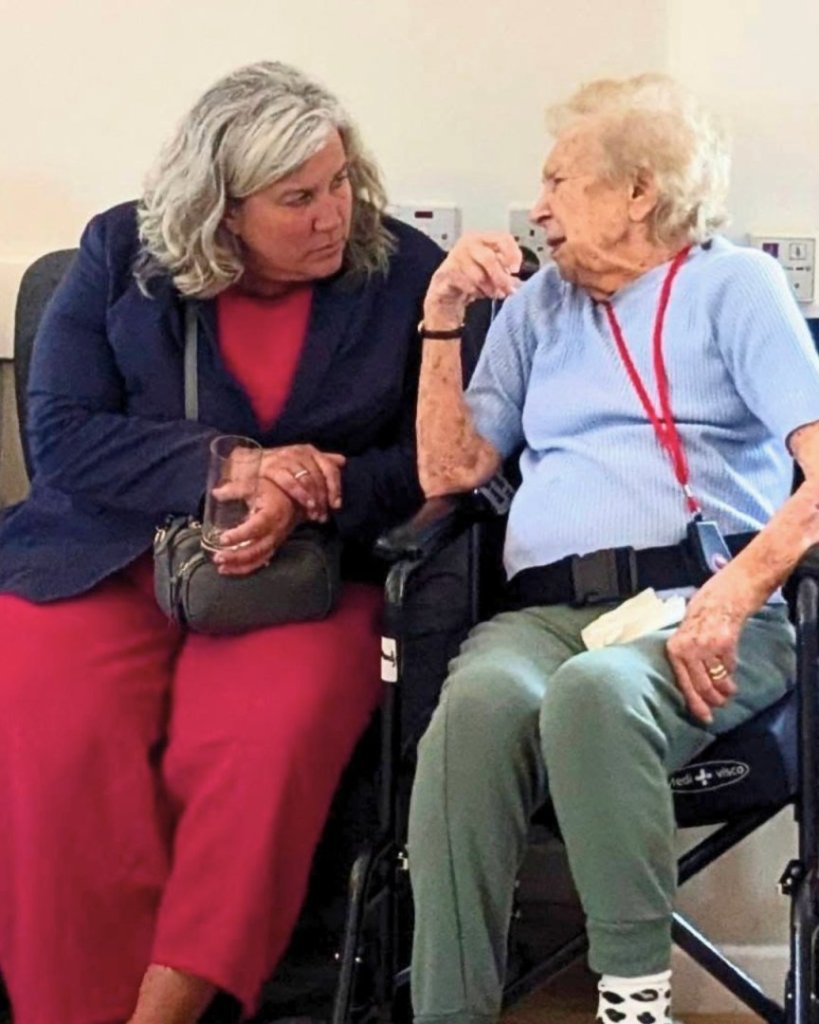 Heidi Alexander MP speaking with a resident at Kingsmead Care Home during Care Home Open Week.
