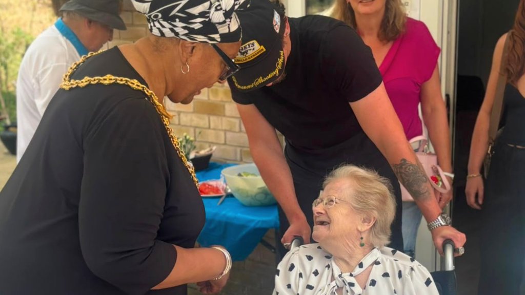 Councillor Pat Bruce-Browne, Mayor of Ipswich, with a resident and their relative at Handford House during Care Home Open Week.