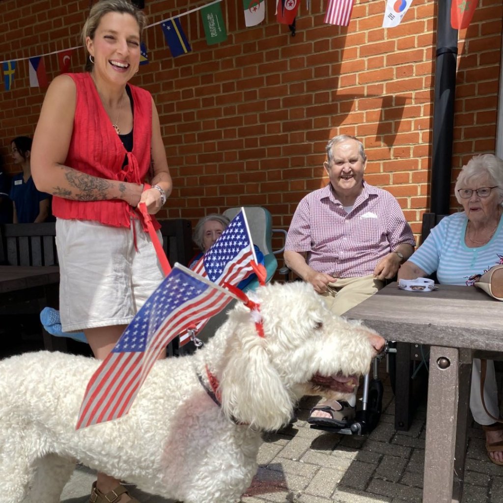 Larry the PAT dog visiting residents during the Walcot Hall Summer Fete.