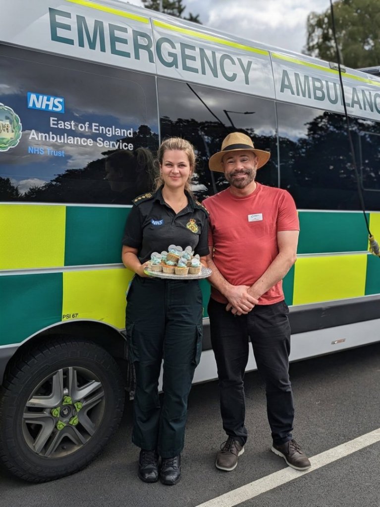 Nicolas Pearkes, Activities Coordinator at Handford House, presents cakes to emergency service workers for 999 Day