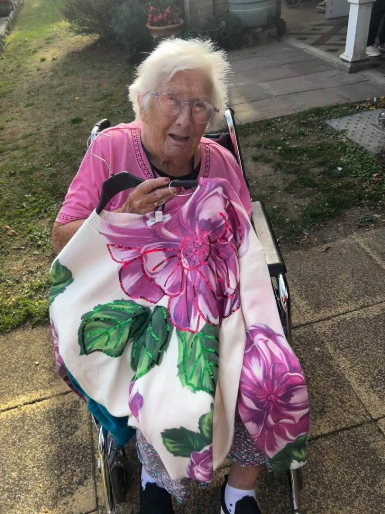 Uvedale Hall resident looks through clothes at the pop-up shop