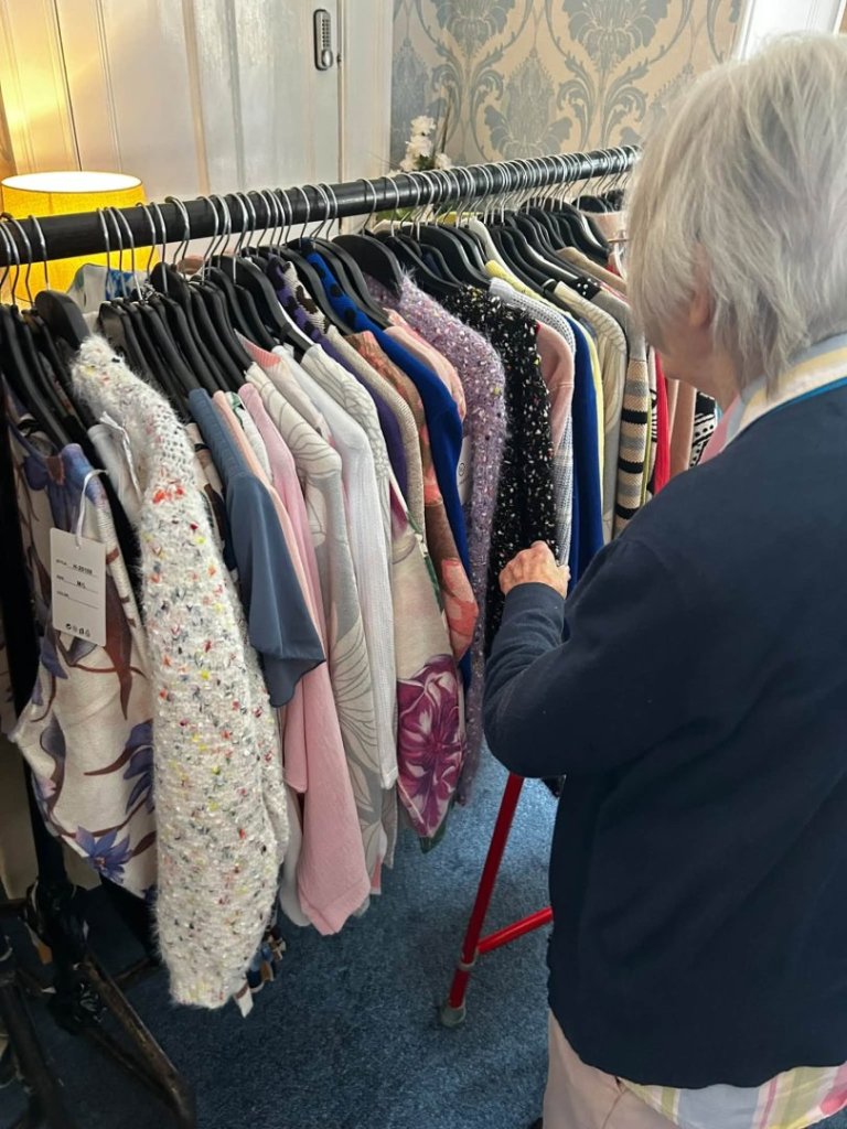 Uvedale Hall residents browse clothes at a pop-up shop in the care home