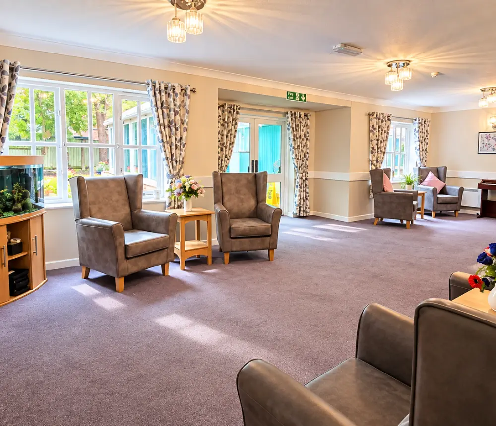 Spacious communal lounge at Ladymead care home in Swindon