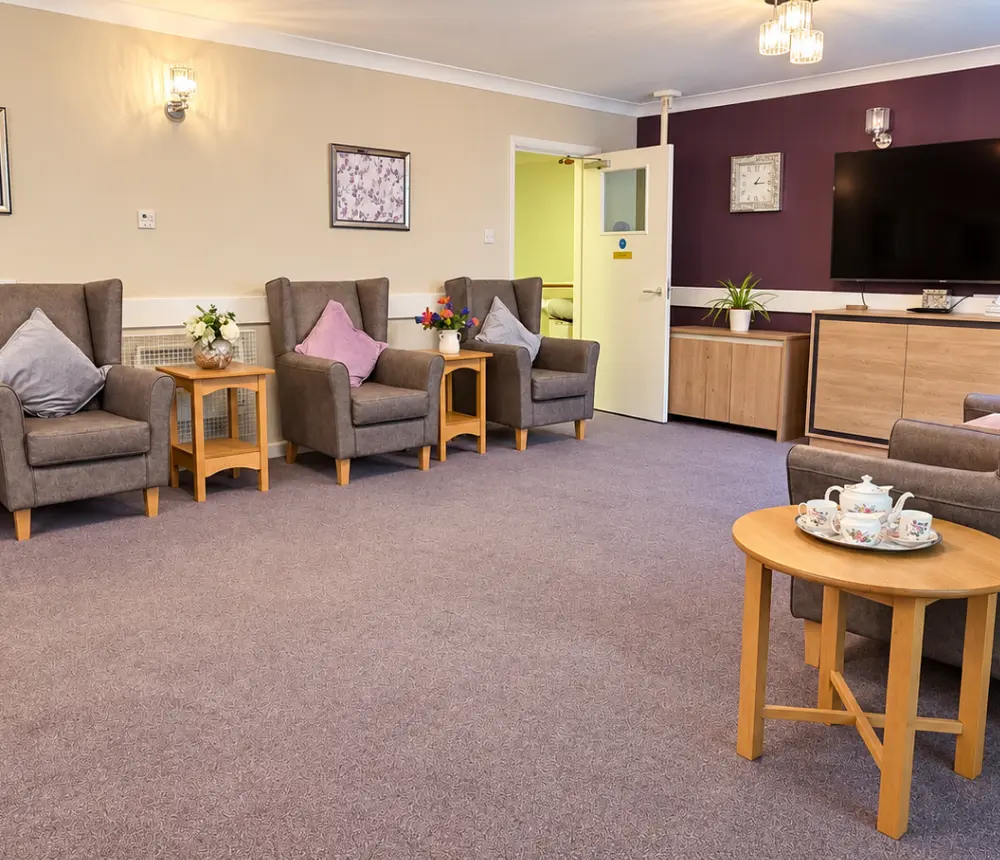 Welcoming communal lounge at Ladymead nursing home in Swindon