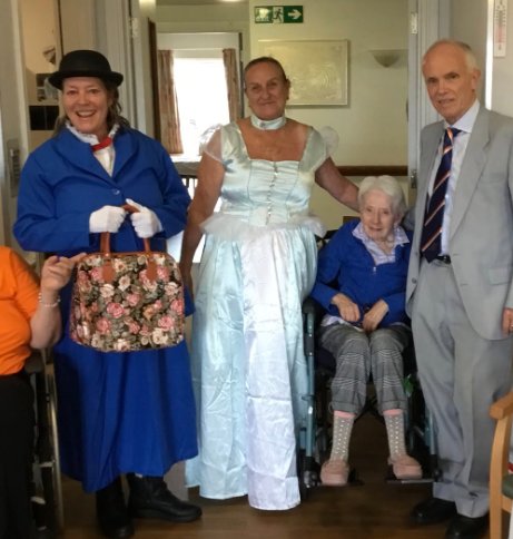 Michael and Margaret Hatch with staff dressed as Cinderella and Mary Poppins at Avon Lodge Care Home