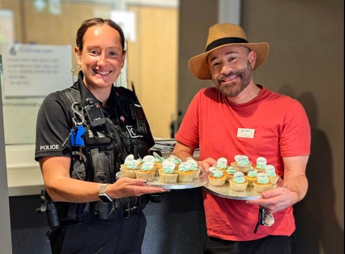 Nicolas Pearkes, Activities Coordinator at Handford House, presents cakes to emergency service workers for 999 Day