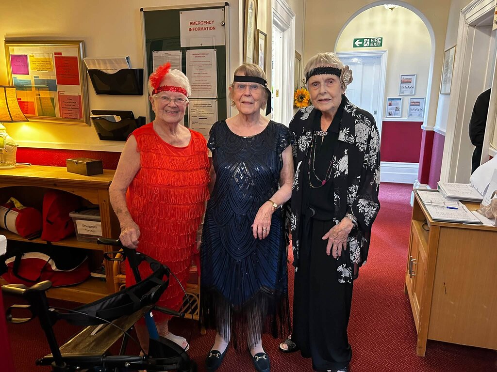 Residents dressed up for a 1920s birthday party at Uvedale Hall